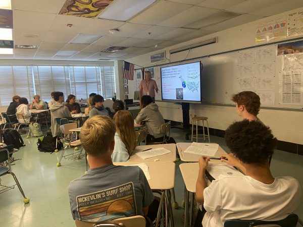 Christopher Merrill lectures his 5th-period AP Human Geography class. This is a typical class for many seniors who choose to take a difficult courseload.