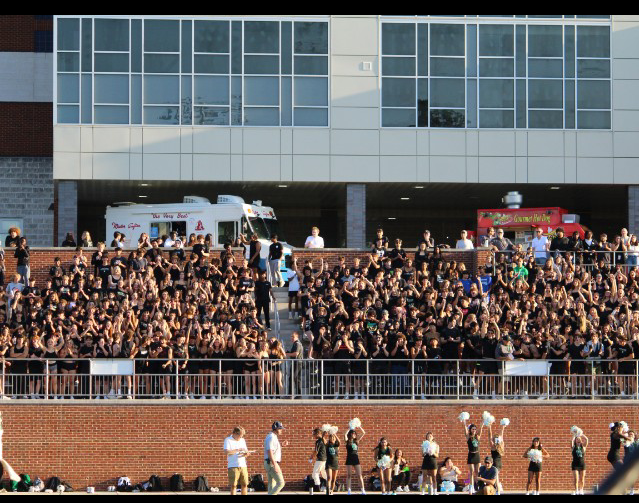 The+Mad+Cow+student+section+cheers+on+the+football+team+in+a+Friday+night+game+at+B-CC.+Despite+administration+and+students+following+safety+protocols+and+remaining+spirited+at+the+game%2C+multiple+WJ+students+were+attacked+at+the+Bethesda+Metro+station+following+the+game%2C+outraging+the+Bethesda+community.+%E2%80%9CI+don%E2%80%99t+recommend+going+to+downtown+Bethesda+or+even+to+Georgetown+Square+after+events.+Just+go+home%2C+do+something+else+fun+and+keep+yourself+safe+because+the+school%E2%80%99s+reach+is+only+so+far%2C%E2%80%9D+Principal+Jennifer+Baker+said.