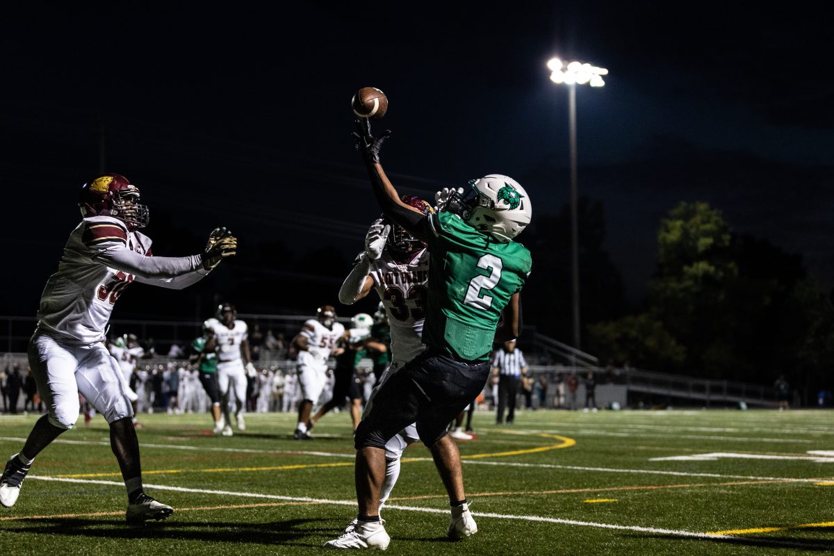 Sophomore Dylan Byrd attempts an end zone catch. Byrd rushed for 173 yards with one touchdown against Paint Branch.