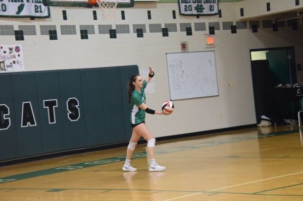 Senior Maya Zutshi takes the serve in a 3-1 loss at the hands of Magruder. This was the last game of the regular season for the volleyball team, as they will now look to carry their 9-5 record into the playoffs.