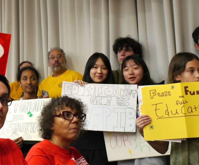 Sophomore Anna Jhon (left) and senior Erin Kim (right) advocate for the incorporation of free AP and IB Exams into the Montgomery County Public Schools budget at the County Council in Rockville on April 13.