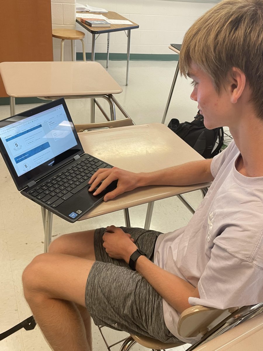 Junior Jasper Goldstein checks his AP test scores from May 2023. With MCPSs recent announcement that they will cover the cost of students AP tests this year, students and their families will save $98 per test.