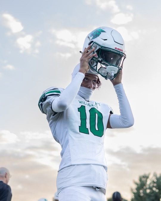 Senior receiver Daniel Kenvo suits up for their face-off against the Vikings. After eight season games, the Wildcats prepare for their toughest matchup against the Churchill Bulldogs.