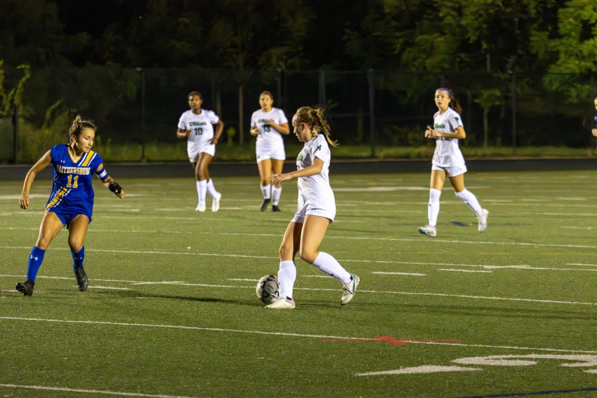 Sophomore Evie Avillo sets up to attack a defender in a one-v-one. Avillo played center mid in the Wildcats game against the Gaithersburg Trojans, winning 8-1.