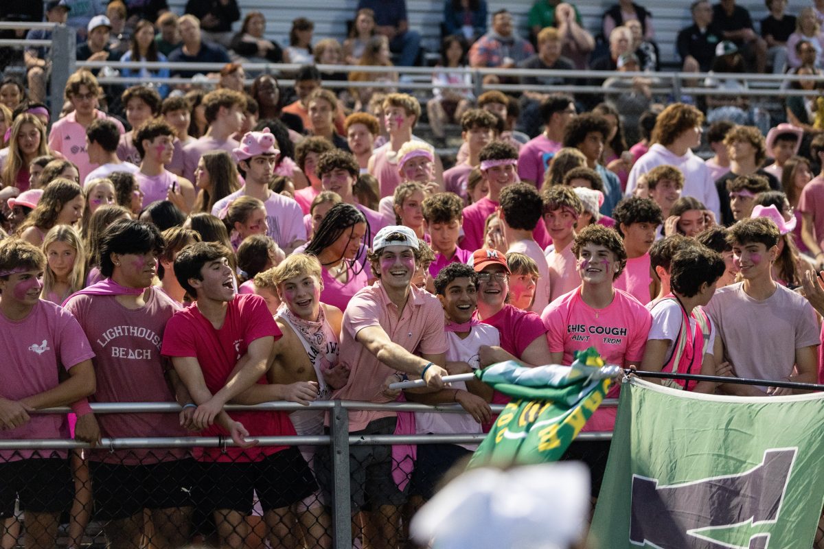 Students+wear+pink+to+cheer+on+their+team+for+the+Wildcats+vs+Blazers+Homecoming+game+on+Friday%2C+Oct.+6.+The+student+section+was+filled+with+triumphant+screams+as+the+Wildcats+earned+their+sixth+win+of+the+season.