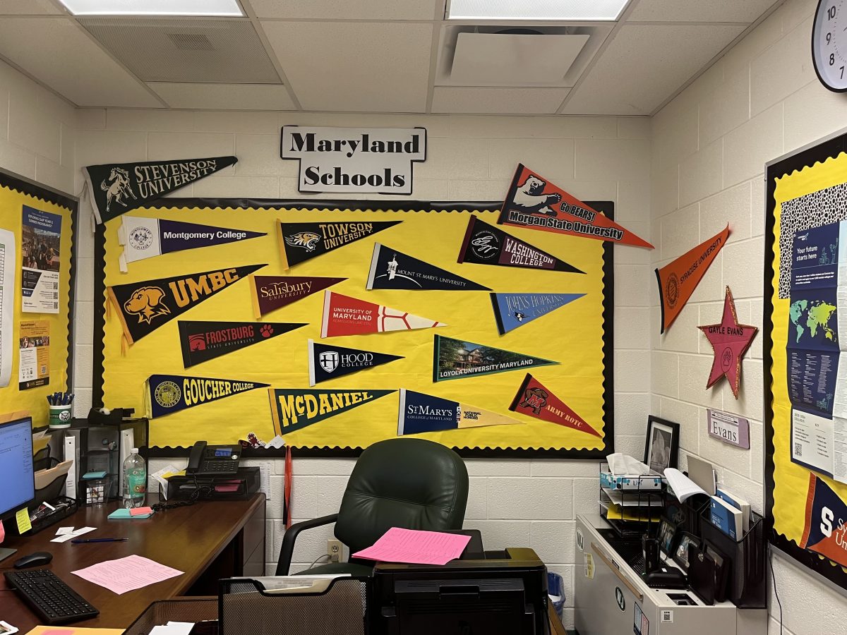 College counselor Gayle Evans displays banners of Maryland colleges in her office. Evans assists seniors with choosing the right major.