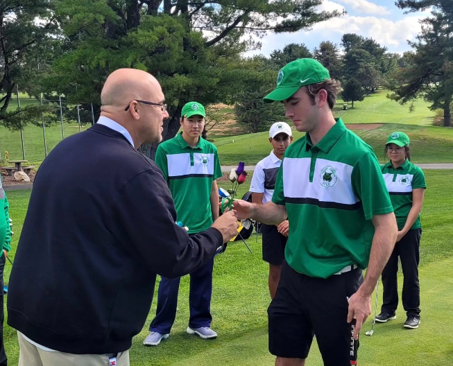 Athletic Specialist Larry Hurd recognizes senior golf players on their senior night at Needwood golf course. The image was posted via @wjwildcatathletics on Instagram. I think that having a social media influence and being able to highlight our athletes and teams all the time is meaningful to the experience of the students and it keeps everyone in the community involved, Hurd said.