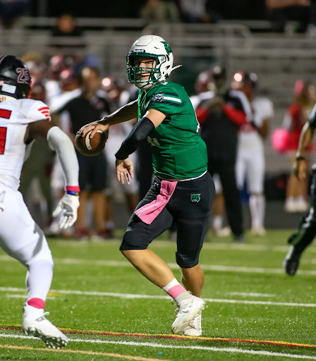 Sophomore quarterback Jake Forburger throws long to left field. This was Forburgers first game as the starting quarterback and led the Wildcats to a 40-14 win.