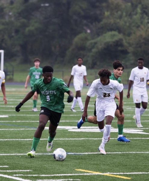 Senior Loic Nsoga-Mahob dribbles down the wing in a match against Richard Montgomery on Oct. 14. The Cats won the game 2-0 thanks to goals from junior Matewos Tuge and senior Ahmed Gugssa.
