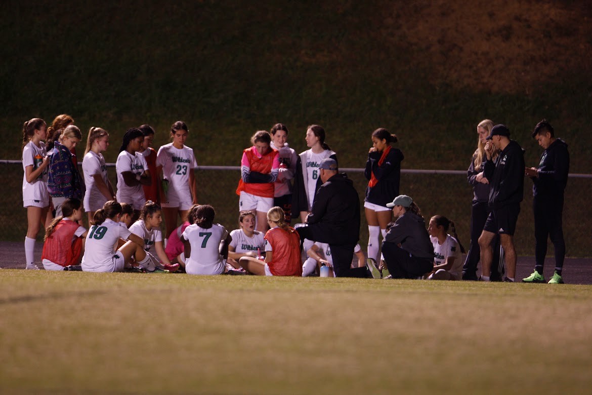 The team huddles for the final time during half-time to discuss strategy for the second half.  With a score of 0-0, the Cats were working to elevate their offensive play.  I absolutely loved the competitive fire in the team and their strong desire to work hard in practice and carry that over to games.  They craved hard work, and that is also on of my favorite parts of coaching WJ.  The work ethic of this team is amazing, coach Neil Gottlieb said.