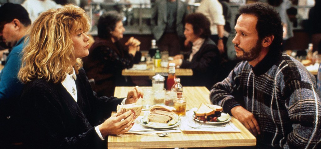 Sally Albright (Meg Ryan) and Harry Burns (Billy Crystal) eat at the renowned Katzs Delicatessen in New York City. This scene is an iconic point in the film and features picky eater Sally rearranging her sandwich in just the way she likes.