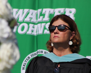 Baker stands at graduation. During her time as principal, Baker graduated over 6,000 students. Baker hopes that she can attend graduation in 2024 following her retirement.