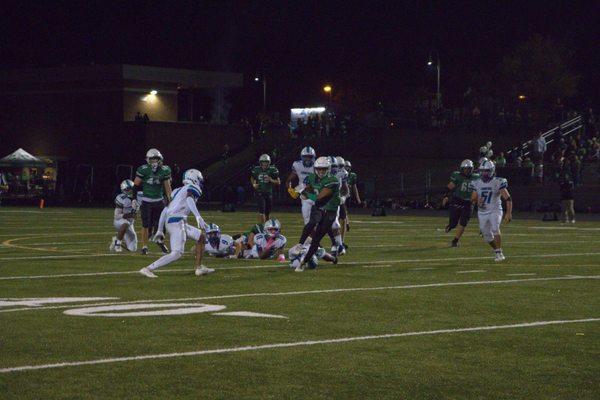 Sophomore running back Dylan Byrd attempts to break free from the Churchill defense.