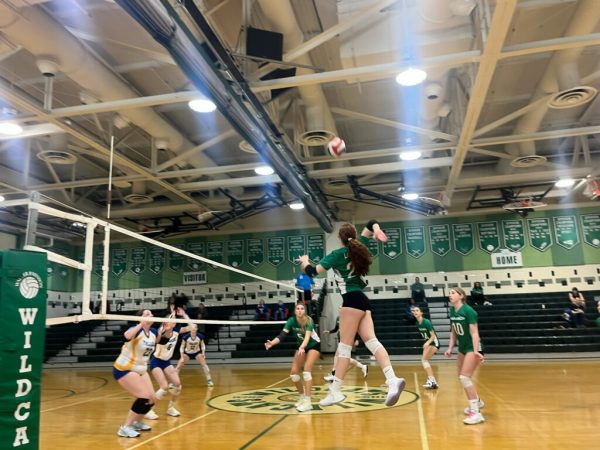 Junior Stella Lichter spikes the ball against Gaithersburg. The team won the match 3-0, but went on to be defeated once again at the hands of Churchill.