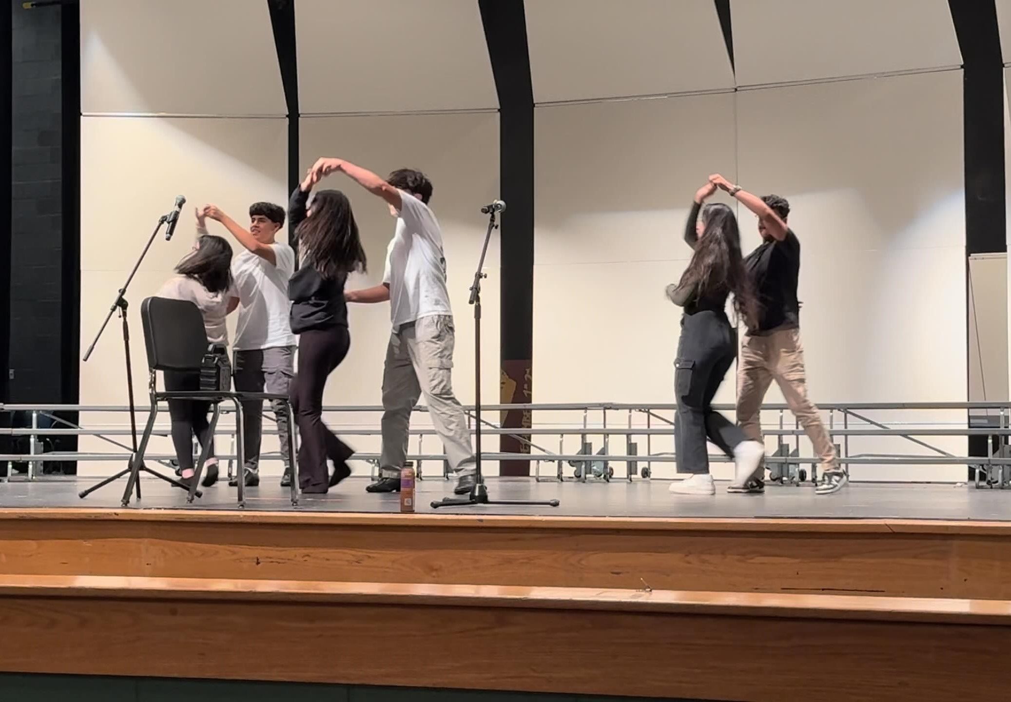 Pasion Latino practices their dance performance after school on the auditorium stage. Im very excited to show what weve prepared to the school, senior Luis Andres Munoz said.