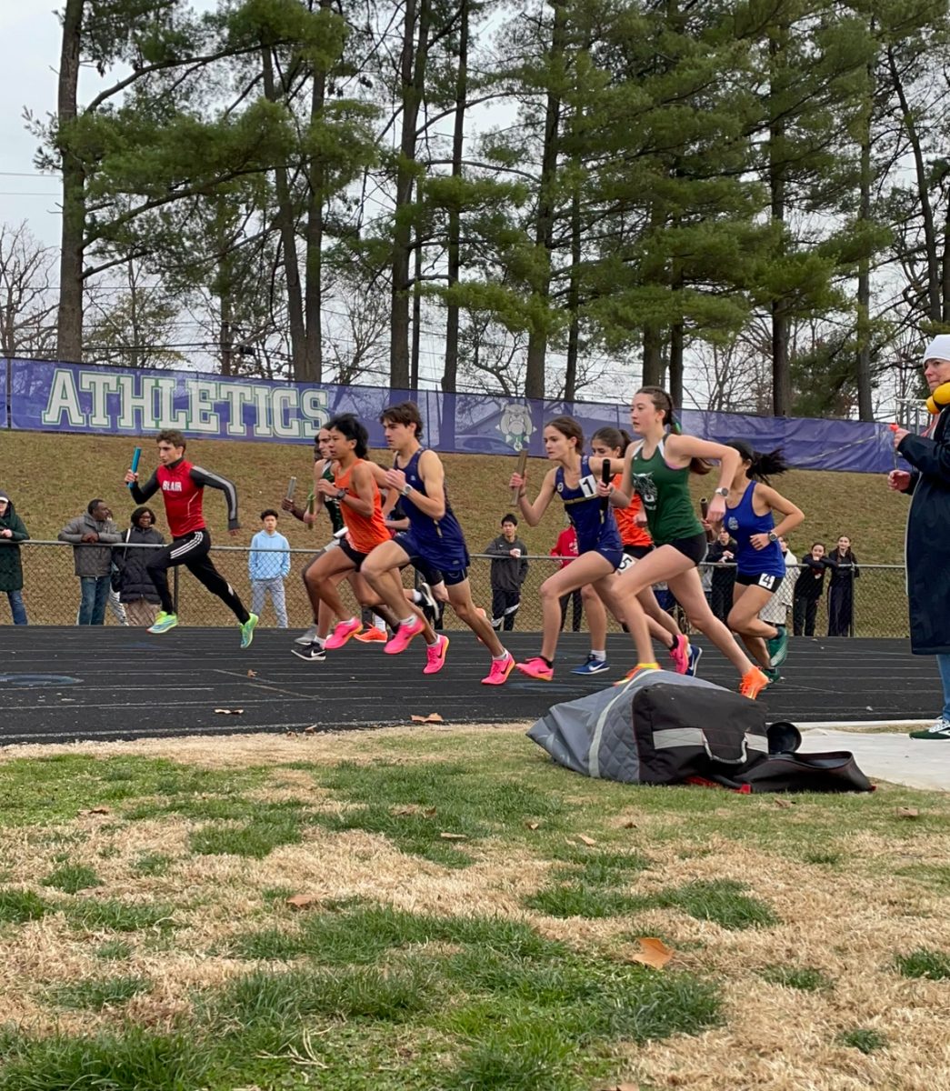 Sophomore Sophia Barrett runs a relay in the Polar Bear track meet on Tuesday, Dec.5 at Winston Churchill High School. Even though this meet didnt count towards their overall record, it prepared them for their upcoming invitational in Virginia Beach.