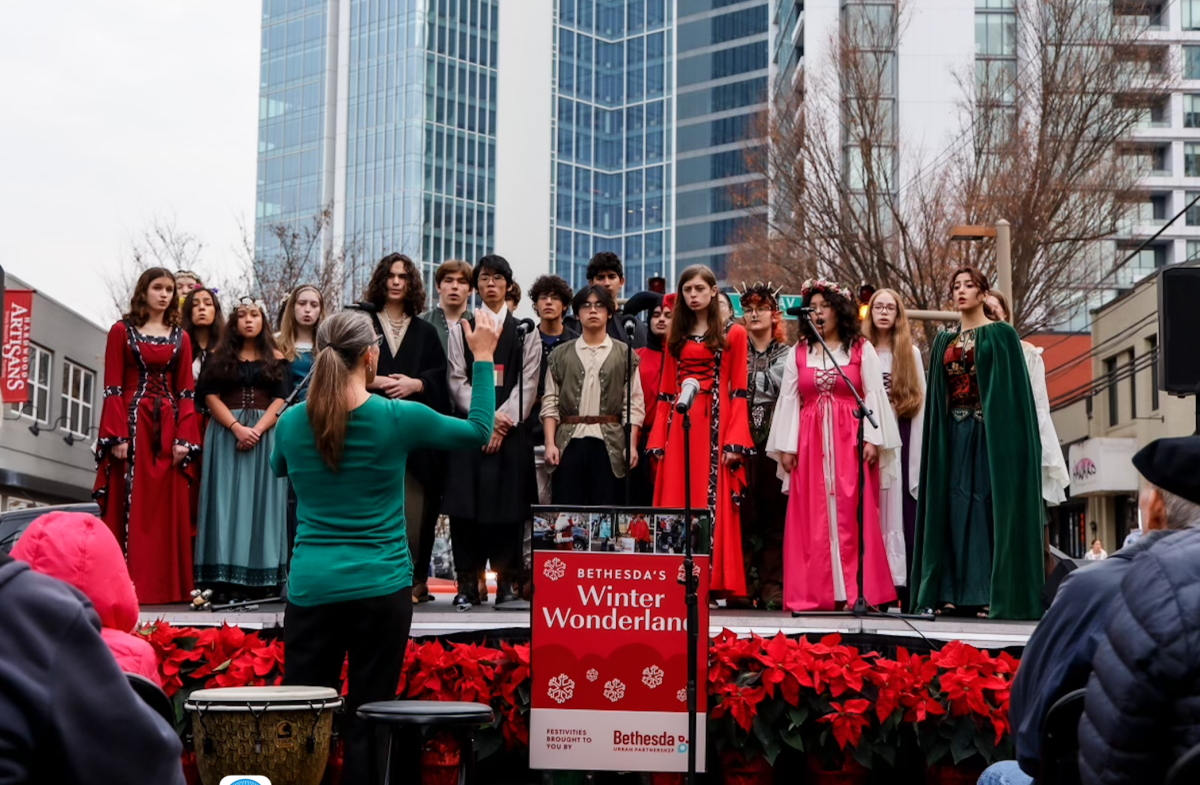 The choral group Madrigals performs on stage at Winter Wonderland. “I love performing for the community, and anything I can do to give back I always try to make happen. The community has been a great support system for WJ, especially in the Music Department and the least that we can do is sing for them to hopefully brighten their day,” senior Henry Saybolt said.