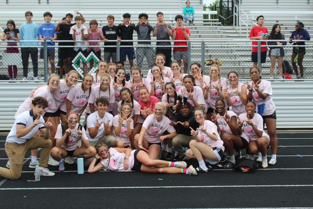 The junior powderpuff team from 2022 takes a team photo after the win against the senior class of 2022. This was the final year that powderpuff was held as the event ended due to injuries occurring.