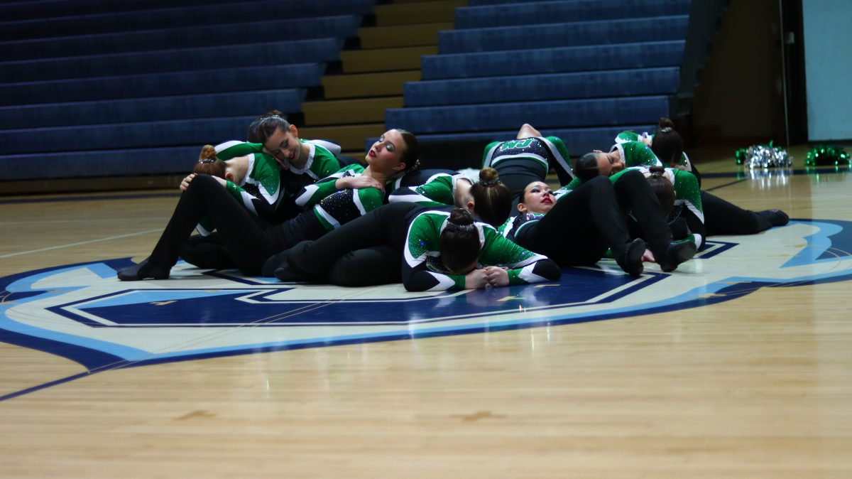 Walter Johnson Poms team performs a routine at Springbrook High School in their first invitational of the season. They are in their beginning formation for the lyrical section of the routine.