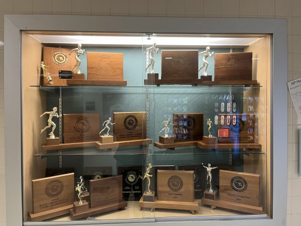 Located in the hall of the main gym, this trophy cases houses more trophies from cross country and track.