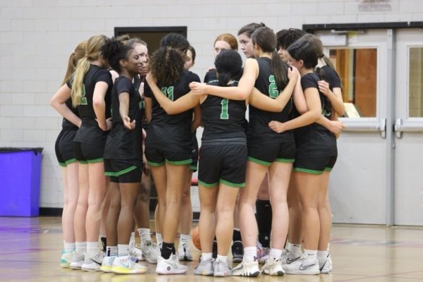 The girls varsity basketball team have a team huddle before their game against the Walt Whitman Vikings. The Cats lost the game 51-29 on Friday, Jan. 5.