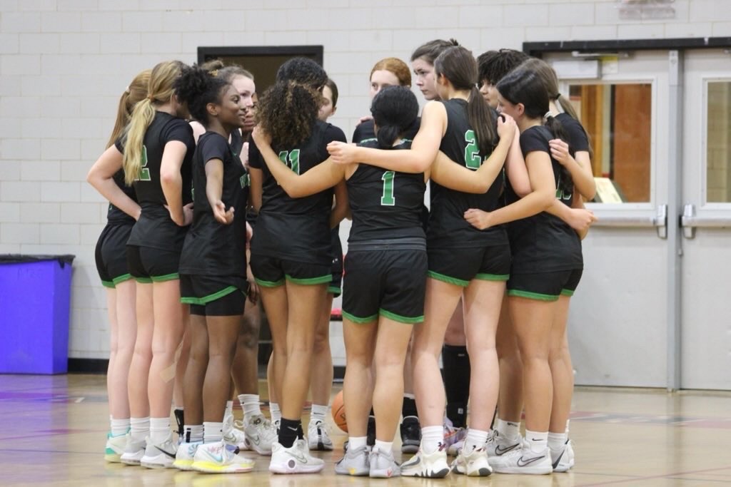 The+girls+varsity+basketball+team+have+a+team+huddle+before+their+game+against+the+Walt+Whitman+Vikings.+The+Cats+lost+the+game+51-29+on+Friday%2C+Jan.+5.