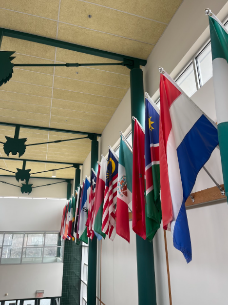 The+flags+at+the+front+of+the+school+represent+our+diversity+and+the+nationalities+of+students.+Wj+emphasizes+a+global+connection+and+develops+an+interest+in+cultural+differences.
