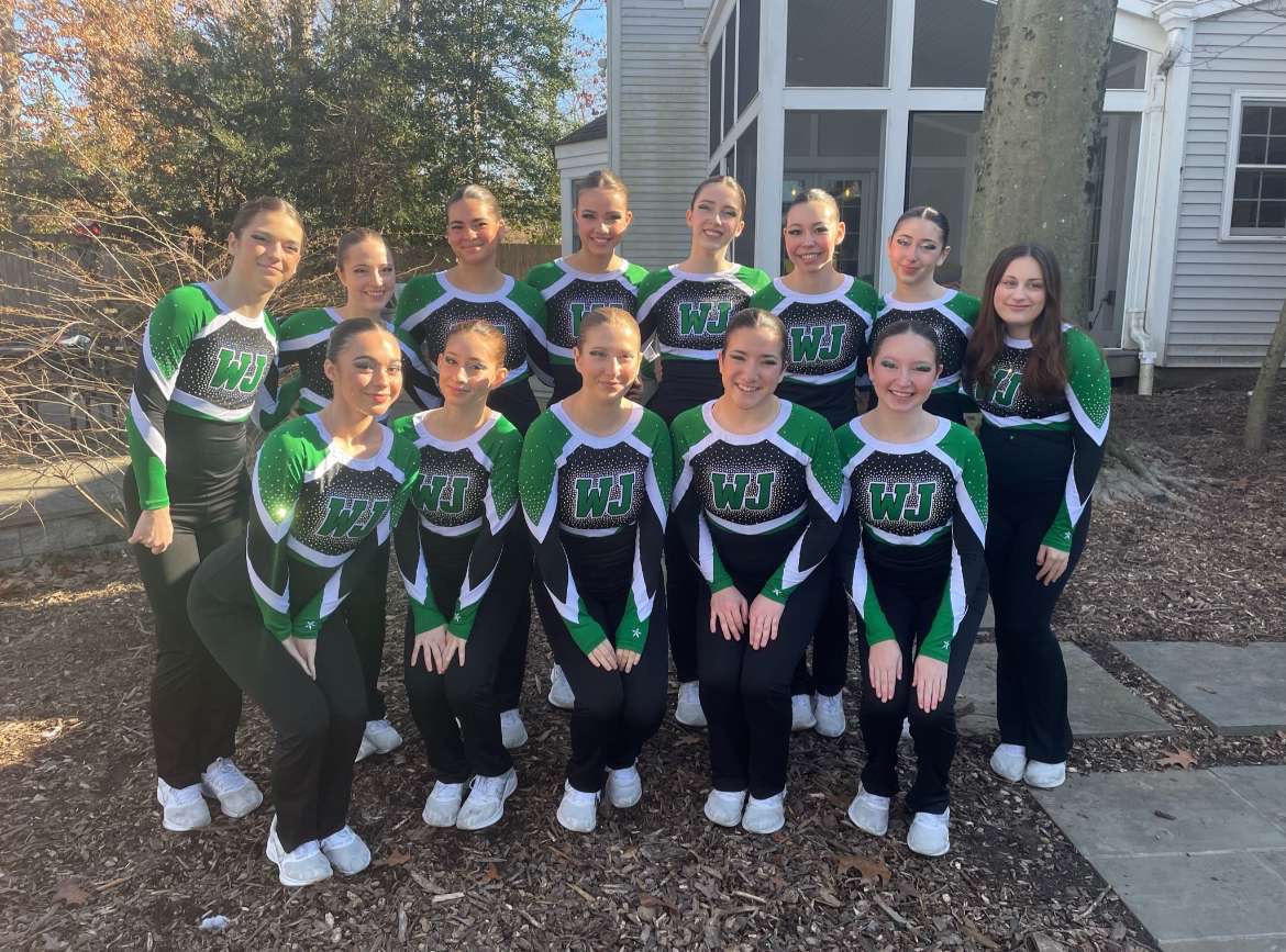 The Poms team poses for a picture at a house before the county meet. They were nervous but excited to show what they had been practicing.