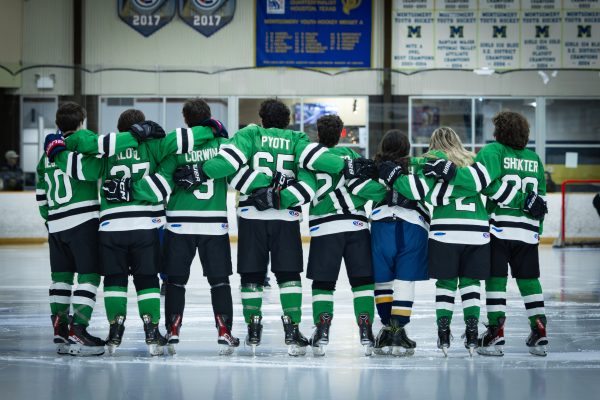 WJ hockey seniors line up on the ice in the pre-game ceremony. The teams eight seniors all played during the game, although they combined for only two points.