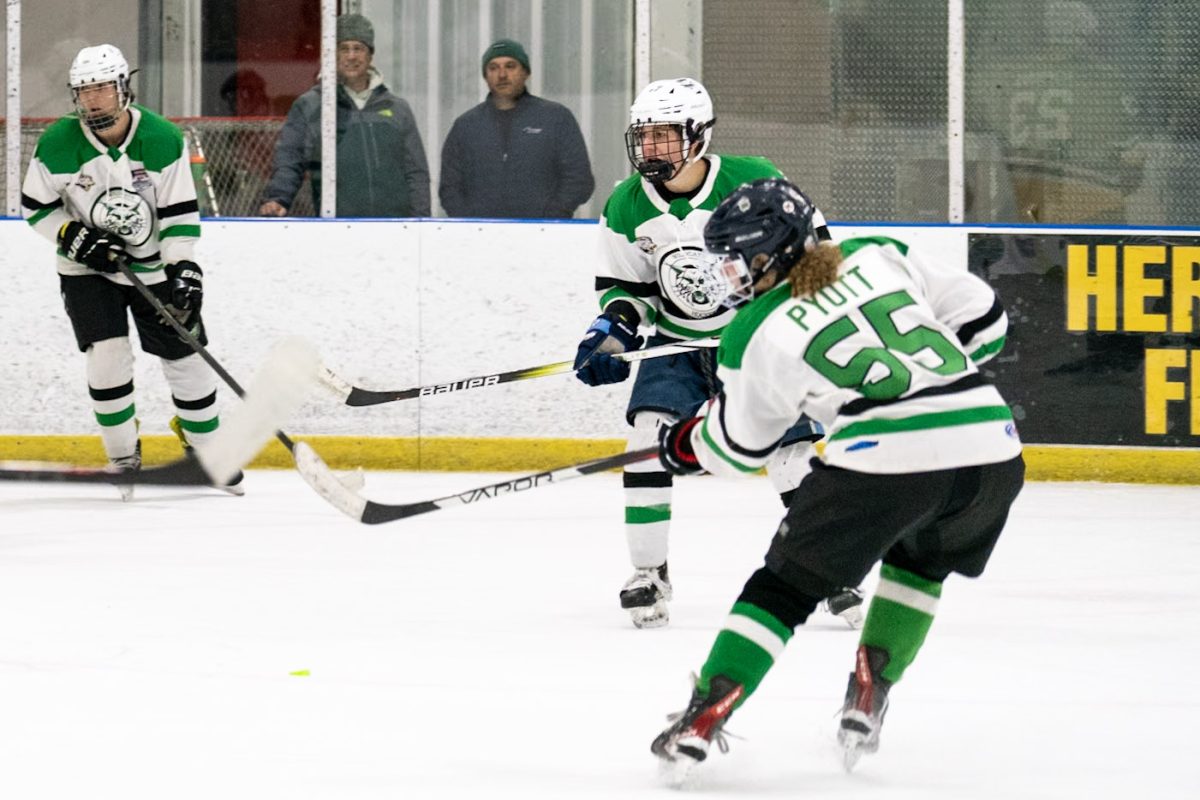 Sophomore Sophie Pyott sends a pass to her brother Adam Pyott (left corner) which leads to a goal for the Cats on Nov. 21, 2023, when the Cats faced the Upper Montgomery Lightning.