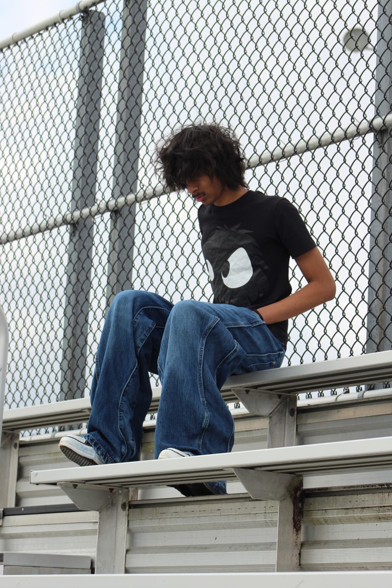 Sophomore Ibrahim Khalid stunts his signature flared jeans and a graphic tee. He admires Rick Owens pieces and is wearing a pair of the Rick Owens boots. Khalid is working on starting his own clothing brand and hopes to officially begin making his apparel soon.