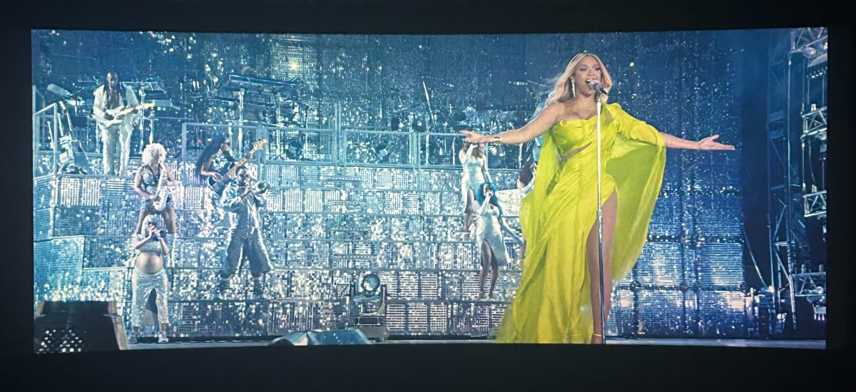 Beyonc%C3%A9+performs+at+her+Renaissance+movie+in+a+stunning+green+dress.++The+fashion+icon+and+iconic+star+has+transformed+pop+and+R%26B+music+and+with+the+release+of+her+song%2C+TEXAS+HOLD+EM%2C+she+could+transform+the+country+music+industry+as+well.++