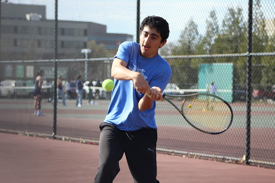 Freshman Mohammad Abbasi hits a backhand during the teams scrimmage against Severna Park High School on March 19. Abbasi is one of five freshmen on the team this year. 