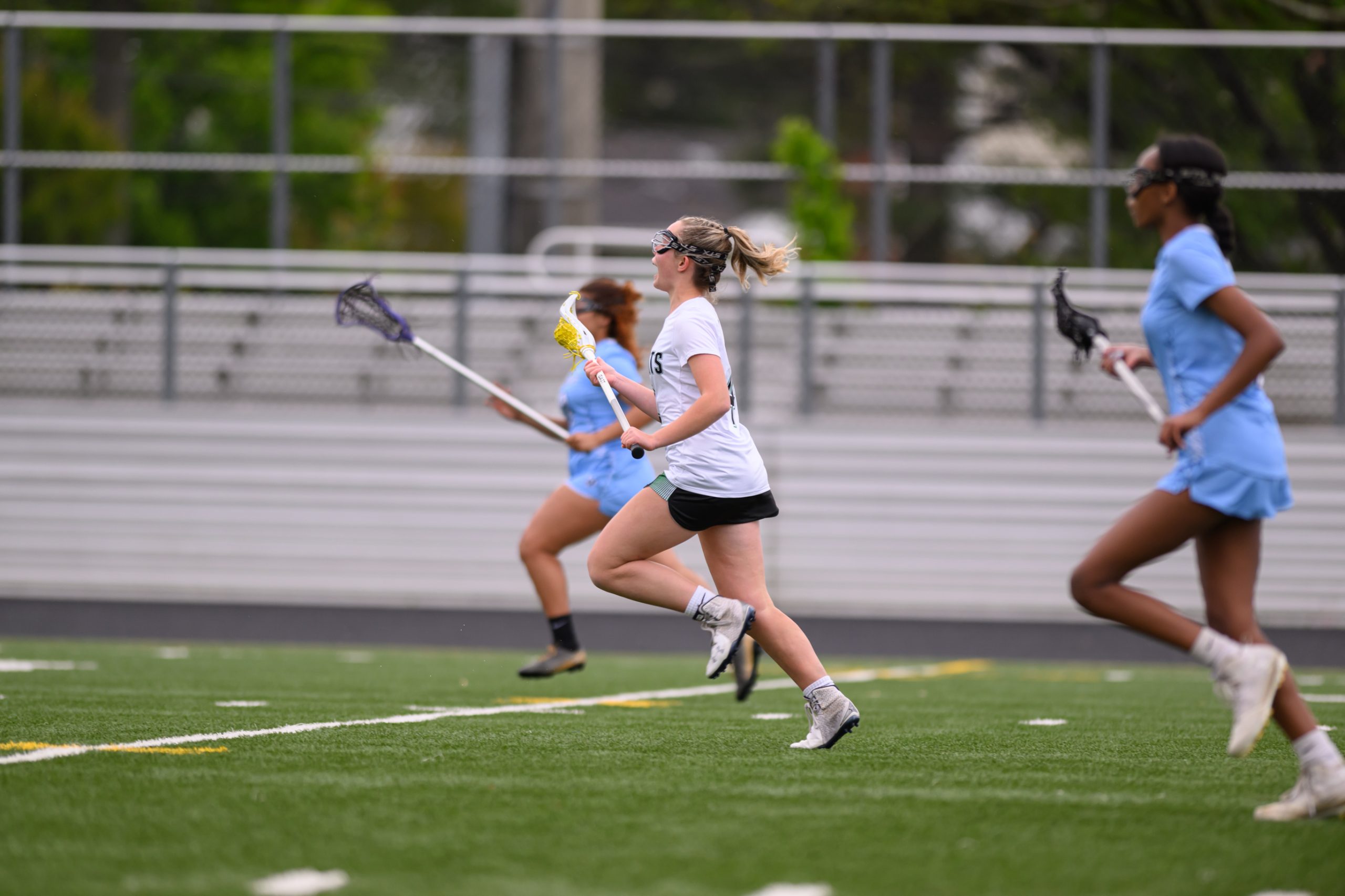 Junior Ginger Fishberg runs up the field during the Cats senior night game for the 2023 season. The Wildcats dominated Springbrook HS 14-1 in that game, and look to replicate similar scorelines this season. (Courtesy Kevin Choi via Lifetouch)