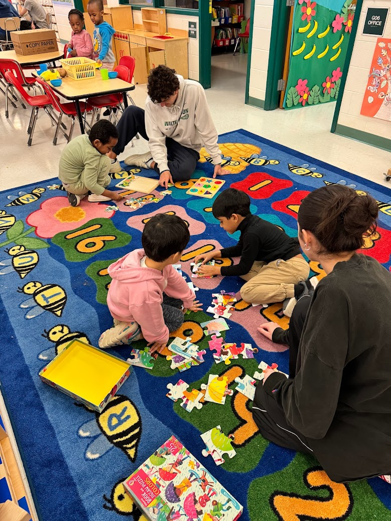 Seniors Noah Diamond and Aubrey Colwell play with the child development students during their transition period. The children get to have free time in between the high schoolers classes as a way to help transition them.