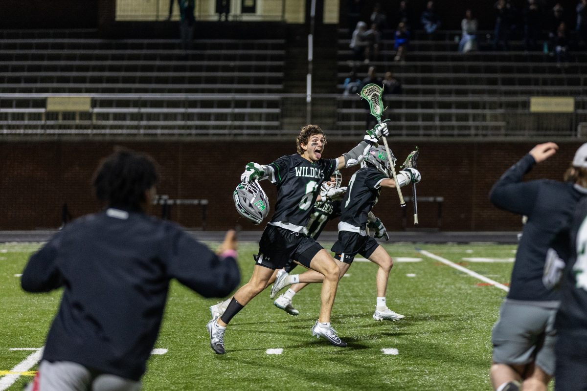 Senior Captain Noah Diamond celebrates with the team after the overtime goal made by senior JR DuBose. This is Diamond’s fourth year on the varsity lacrosse team with no shortage of exciting celebrations.