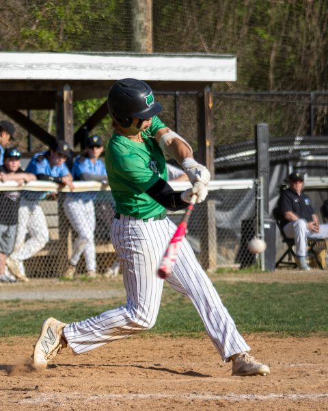 Senior Jay Wandell attempts to hit a ball thrown across home plate. Wandell is committed to play Division I baseball at Towson University next year.