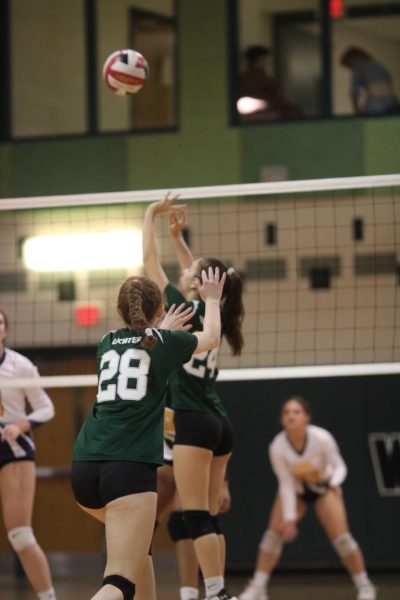 Junior Sofia Silberfeld jumps toward the ball and gets ready to set for her hitters on the team. Setting is a really important part of volleyball and with this new rule, I feel like it undermines the amount of effort that you’ve put in for all these years, Silberfeld said.
