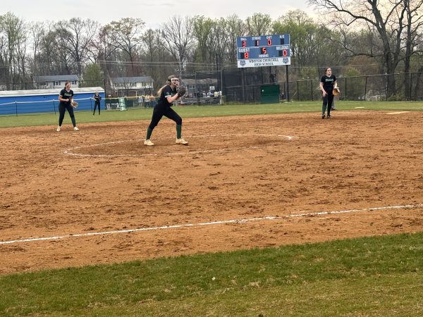 Senior captain Sami Rosenberg sets up to pitch against the Churchill Bulldogs on Tuesday, April 9. The Wildcats beat the Bulldogs 10-2 with Rosenberg striking out 11 batters. (Courtesy Lydia Stelnyk)