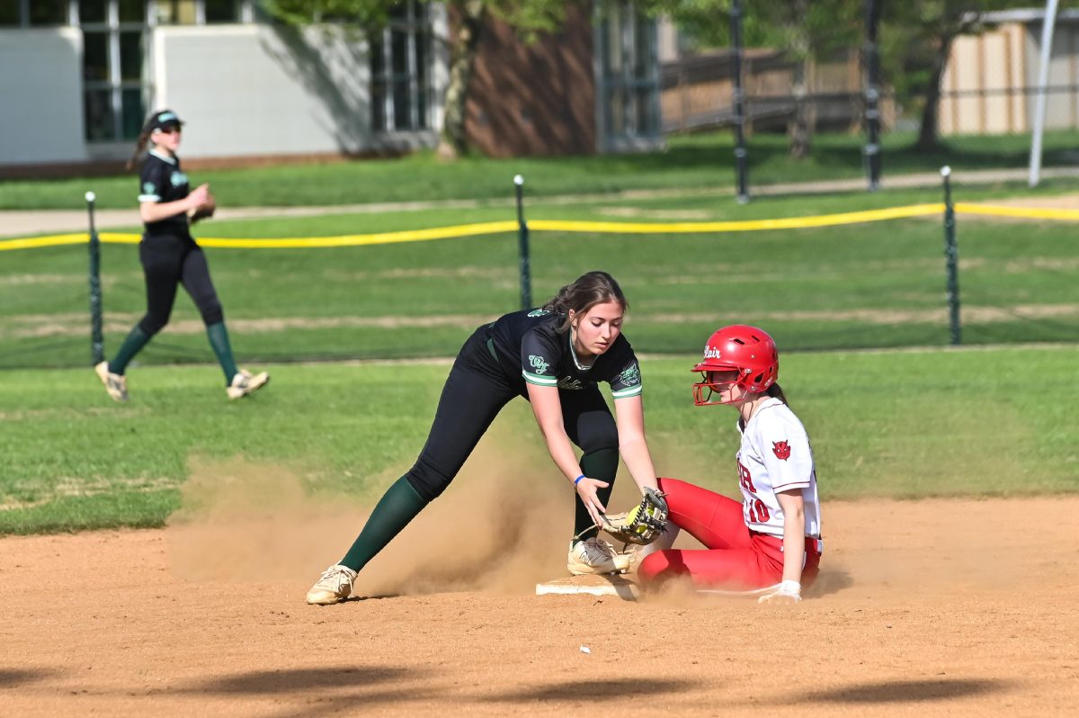 Senior+Carly+Gilder+attempts+to+tag+out+a+Blair+runner.+The+Wildcats+lost+against+the+Blazers+11-10+in+extra+innings%2C+one+of+only+three+losses+this+season.+
