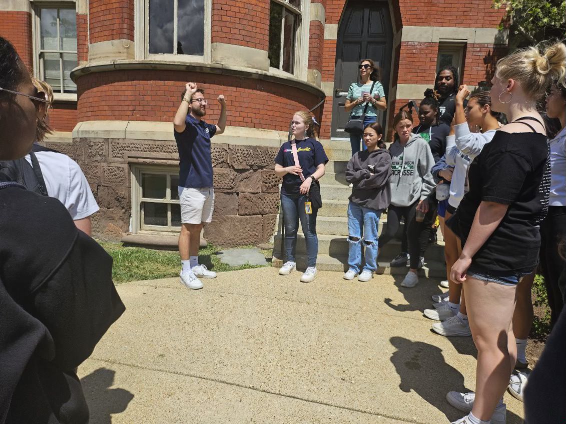 Students listen to Gallaudet University tour. The tour was given by a deaf senior who currently attends Gallaudet.