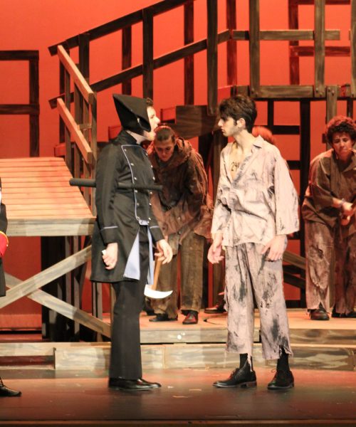 Sophomore Ronan Mailhot (Javert) yells at sophomore Benjamin Kish (Jean Valjean) during the opening performance, “Look down.” The two actors paired very well together, and their interactions throughout the show were fierce and powerful. “A couple months after rehearsal, when they were doing a run-through, literally my jaw dropped…I didn’t even realize some of my friends could sing so well,” freshman Abigail Friedlin said.