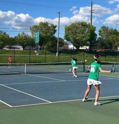 Junior Christina Simpson hits a ball in her doubles match against Quince Orchard. She and her doubles partner, sophomore Sonia Gass, help WJ beat QO 7-0, contributing to the teams current five-game win streak.